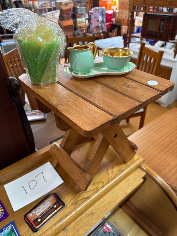 Small collapsible wooden table, flower candle and beautiful green and gold ornaments by crown Devon